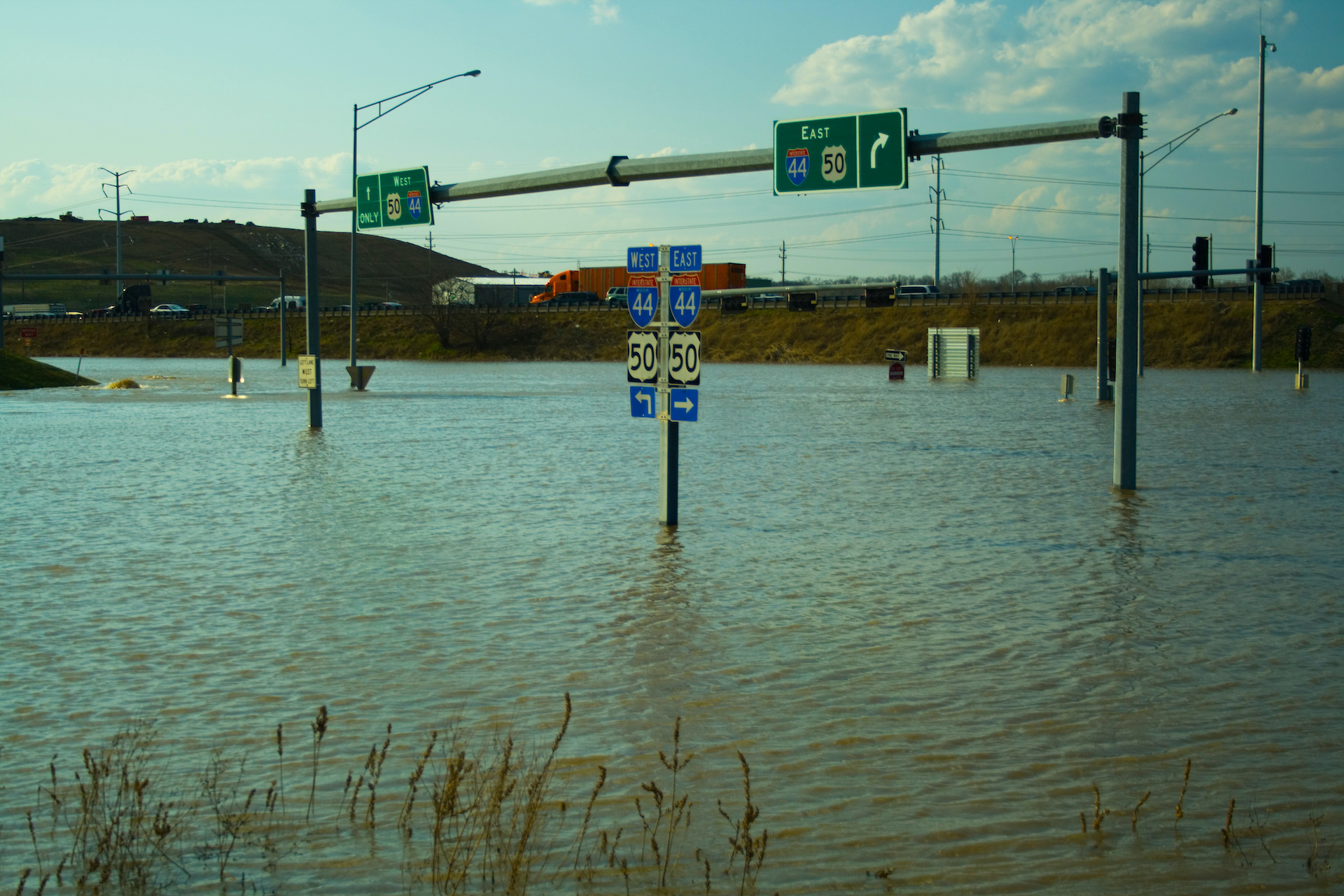 a flooded street with water covering the road