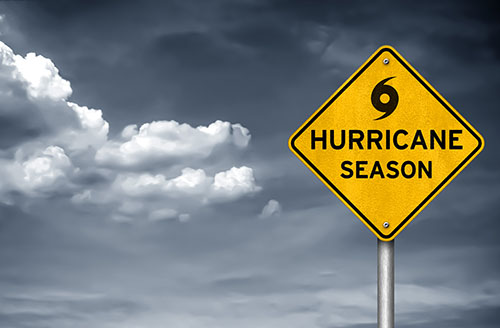 a yellow sign that says hurricane season on it