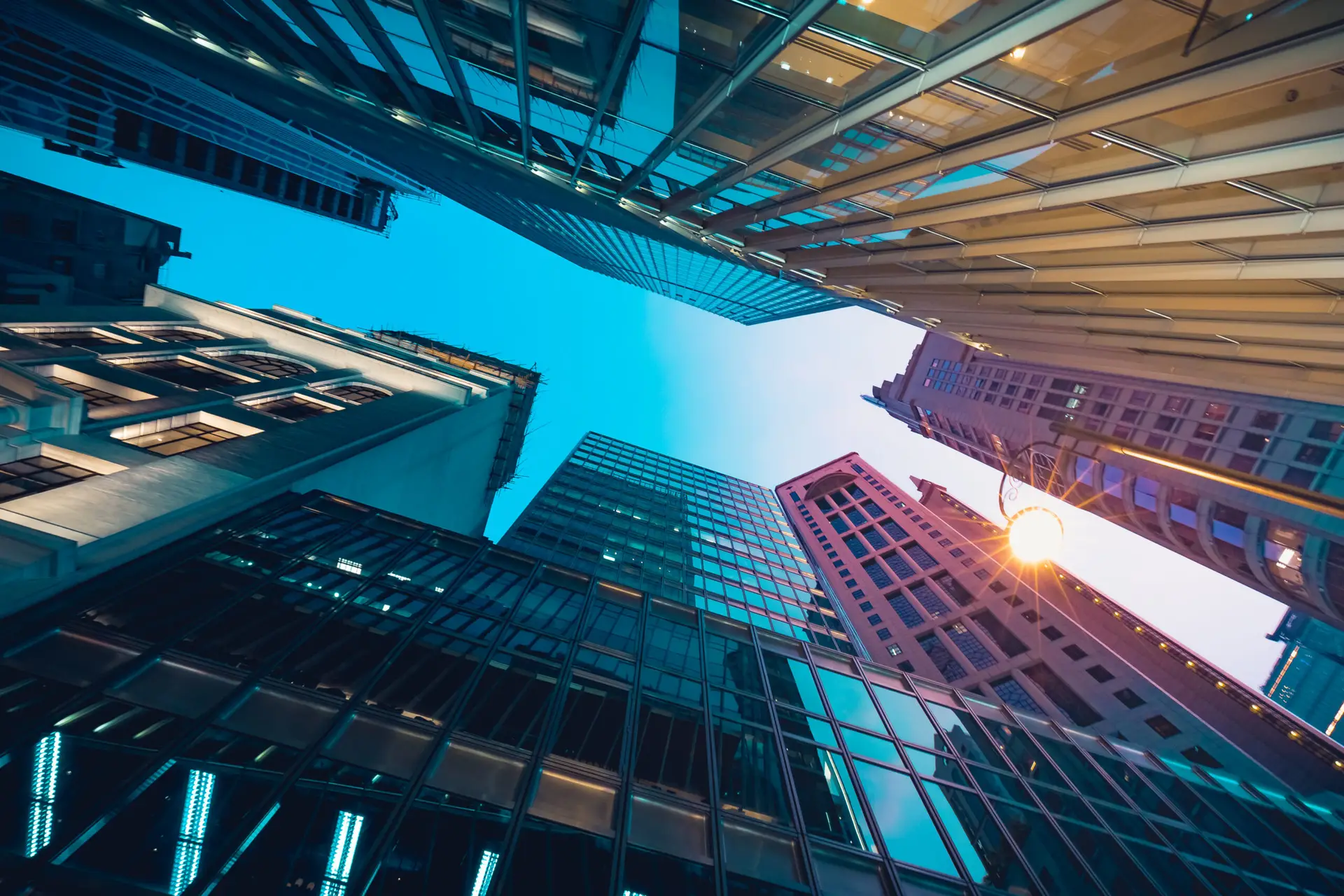 low-angle view of commercial office towers at dusk